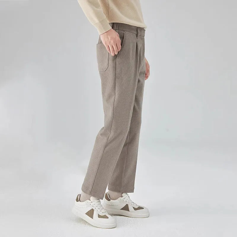 Men's straight-leg corduroy trousers in beige colour showing elastic waistband and loose fit