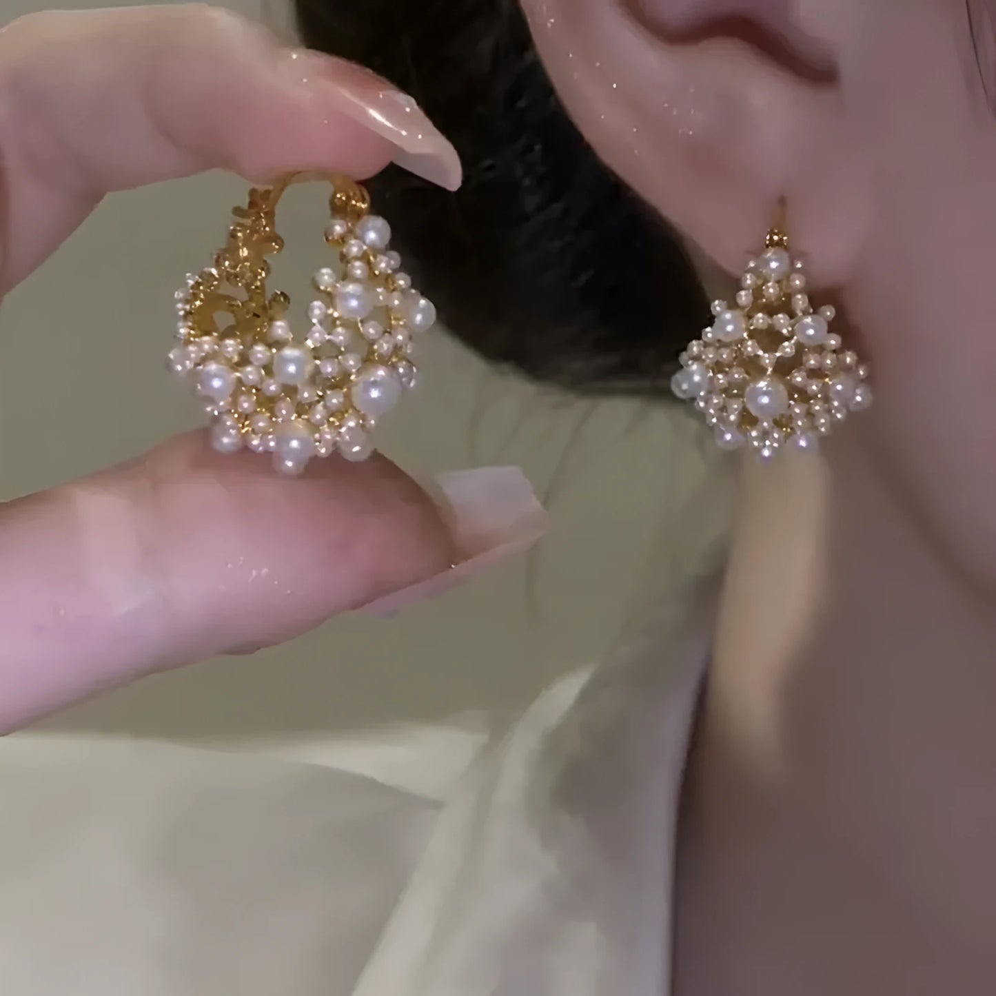 Gold-coloured women's floral basket earrings made from copper with small bead and pearl inlay detail.