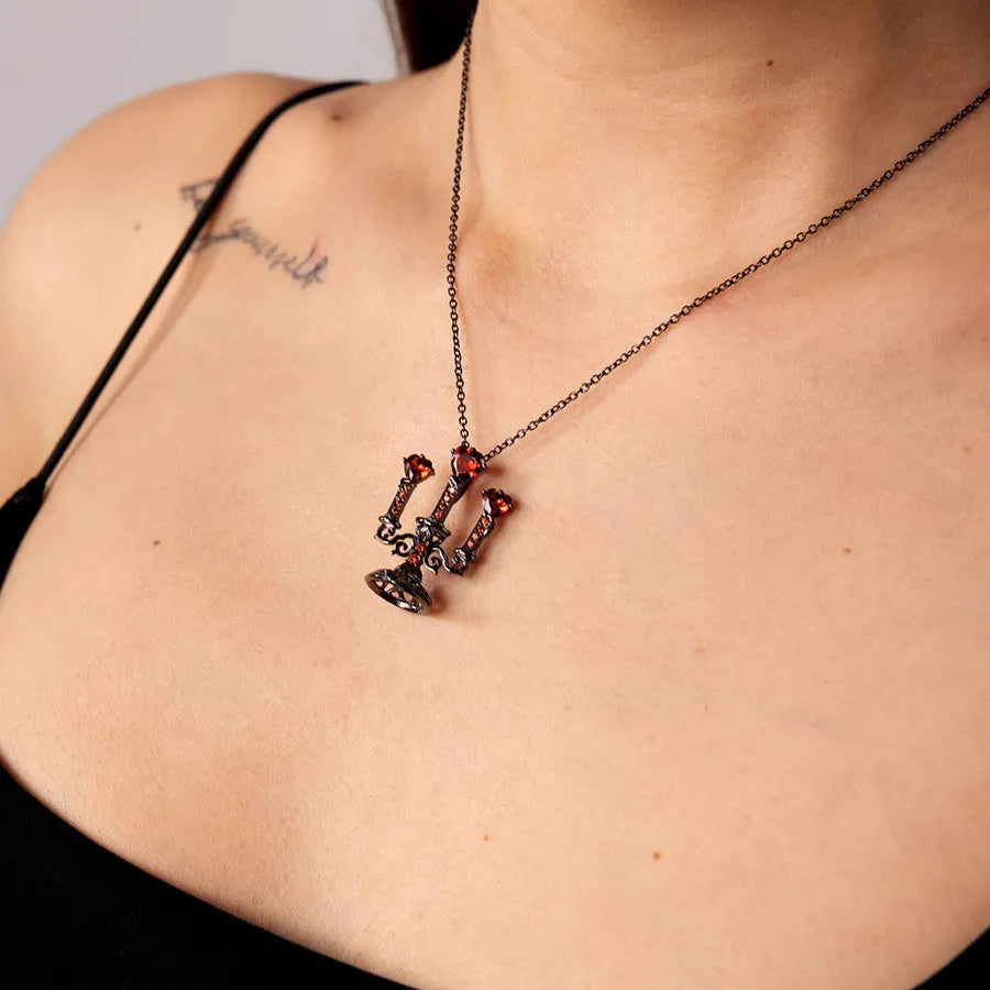 Women's zinc alloy Gothic clavicle chain with a hollow retro candlestick pendant on a cross link chain.