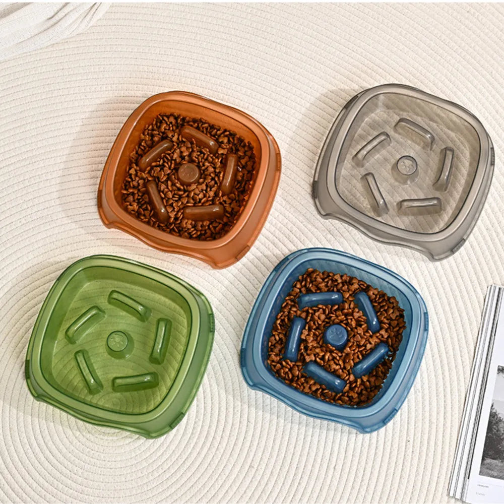 Blue plastic anti-choke slow feeder bowl for dogs on a floor
