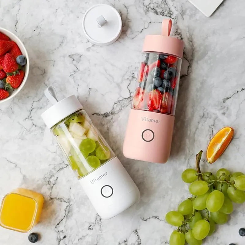 White portable USB rechargeable blender bottle with silicone handle on a Tritan cup.