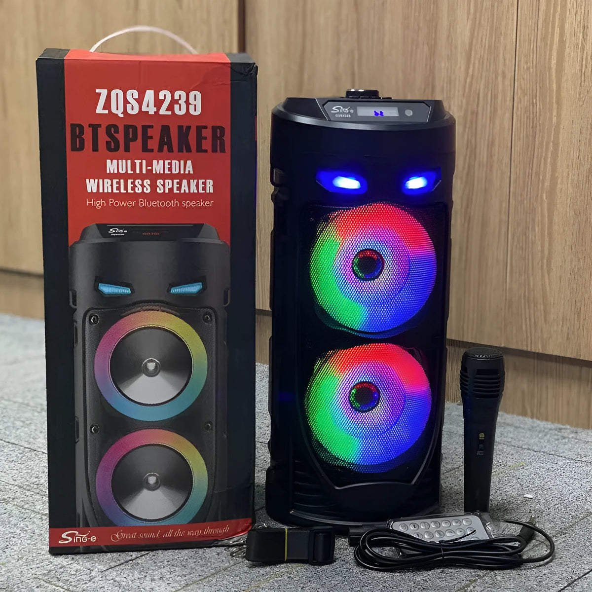 Black portable Bluetooth speaker with dual horn cannon design and wheat-coloured elements