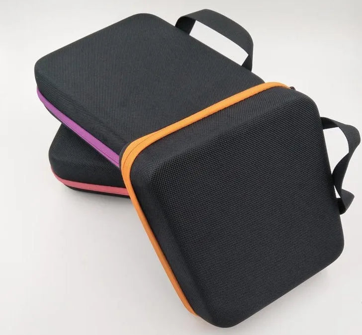 Red cube-shaped EVA essential oil storage bag with 30 compartments, shown mounted on a wall.