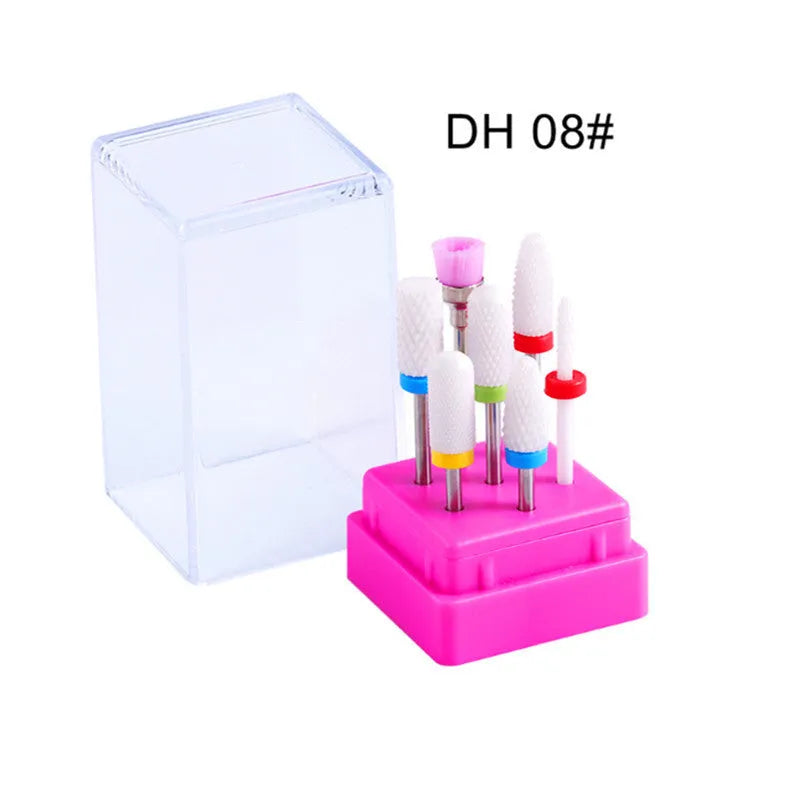 Set of six tungsten steel nail drill bits and a brush in a clear plastic case.