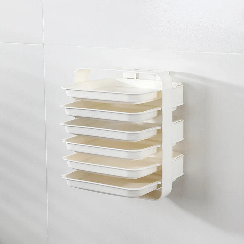 Wall-mounted kitchen shelf with stackable trays in navy blue, white, and coffee colour options
