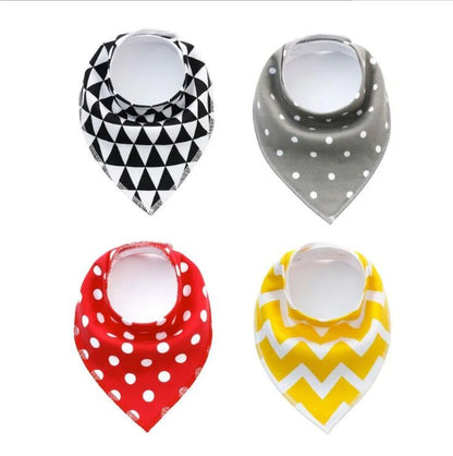 Set of four cotton baby bibs with arrow and wave designs for mess-free feeding