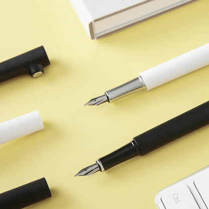 Designer fountain pen with 0.7mm stainless steel nib in black or white resin pen holder