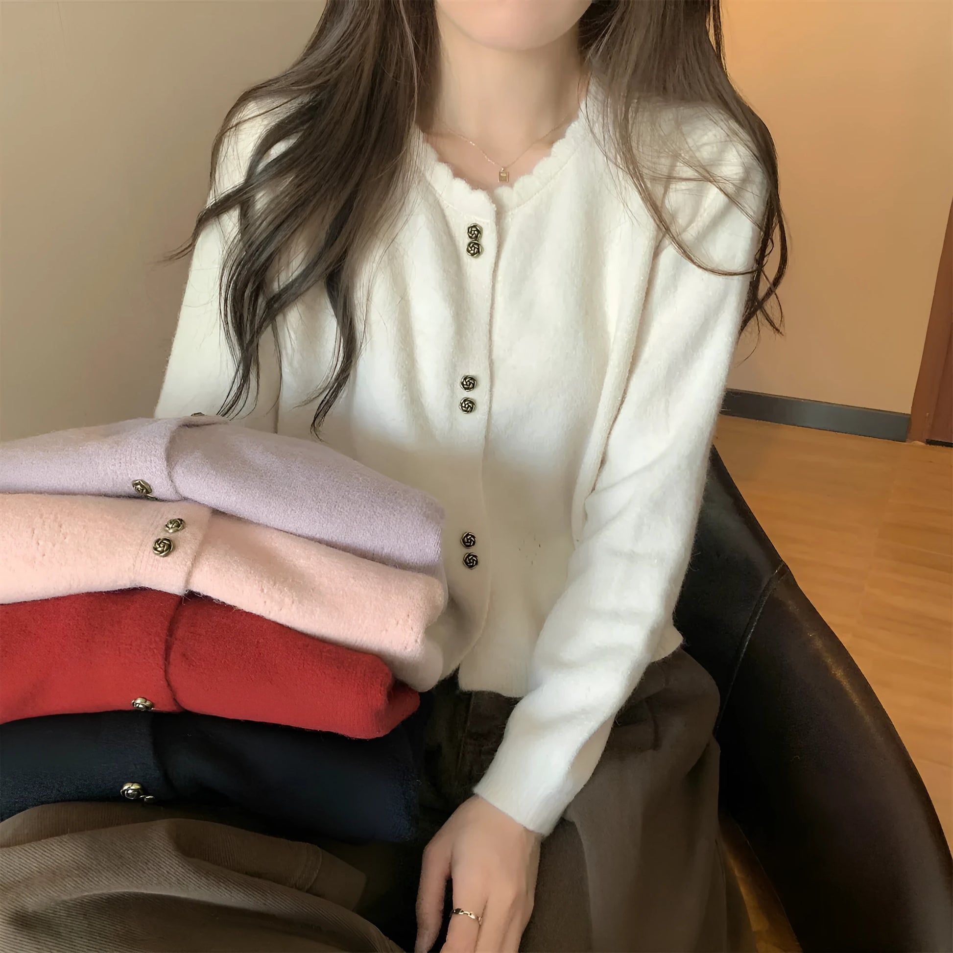 Women's milky white long sleeve acrylic cardigan sweater worn open, showing free size fit and regular sleeve design.