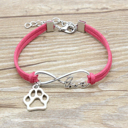 Stylish hand-woven infinite love pet bracelet in various colours, featuring a bow design and made of premium alloy materials