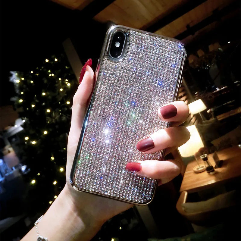 Silver full diamond silicone phone case for iPhone, showing camera and button cut-outs.