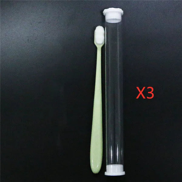 Micron soft toothbrush with coloured handles and different bristle styles including flat head and wavy designs