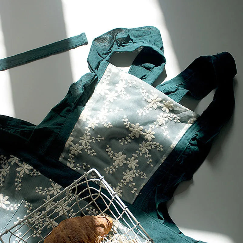 Cotton linen kitchen apron with lace-trimmed X straps in solid colour
