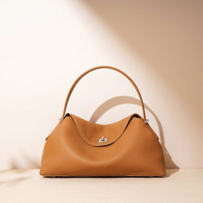 Cowhide leather shoulder messenger bag in a pillow shape with an open pocket and adjustable double straps.