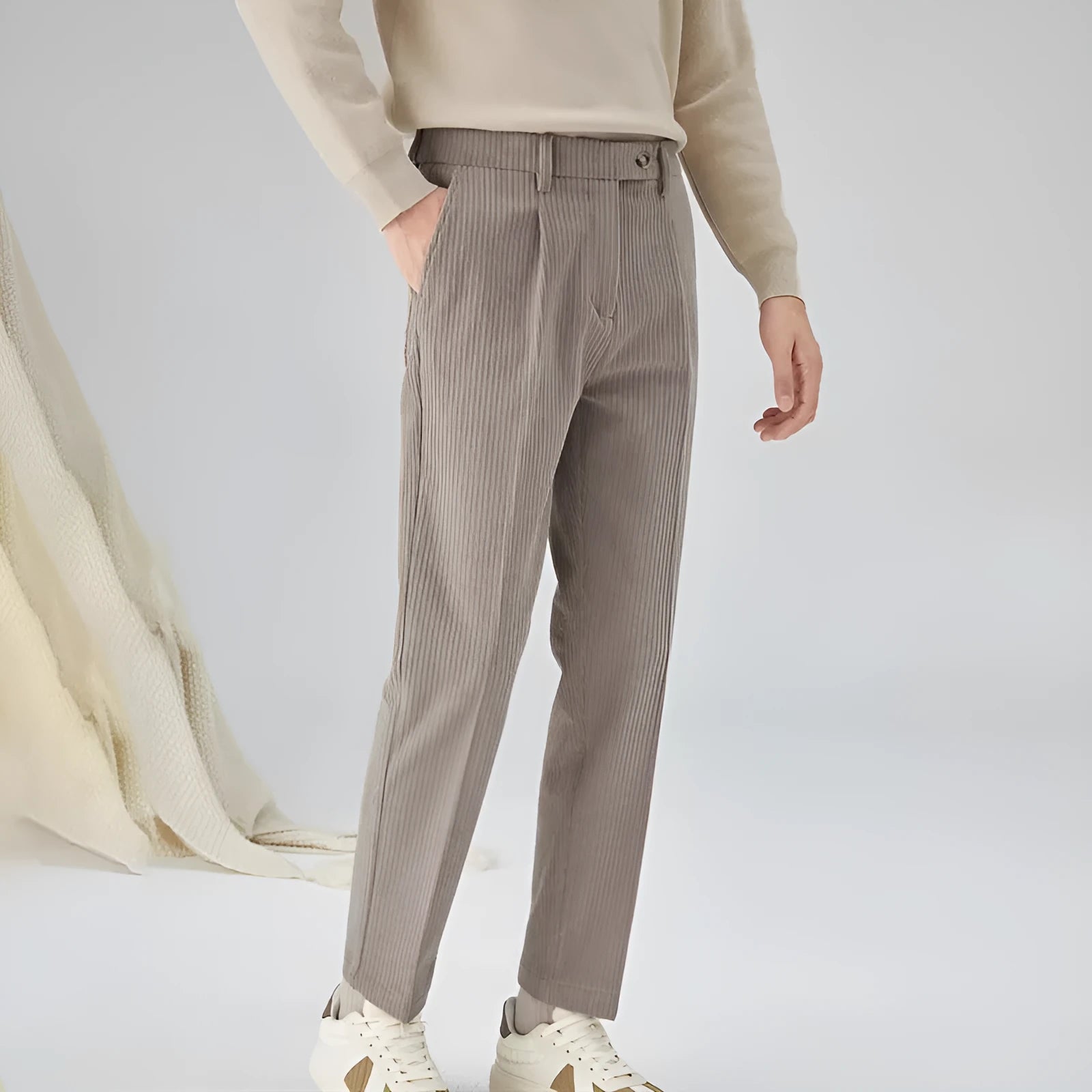Men's straight-leg corduroy trousers in beige colour showing elastic waistband and loose fit