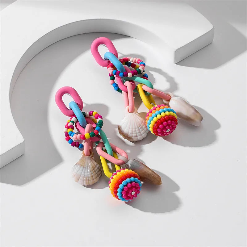 Handmade bohemian shell tassel earrings for women with colourful flower and geometric drop design