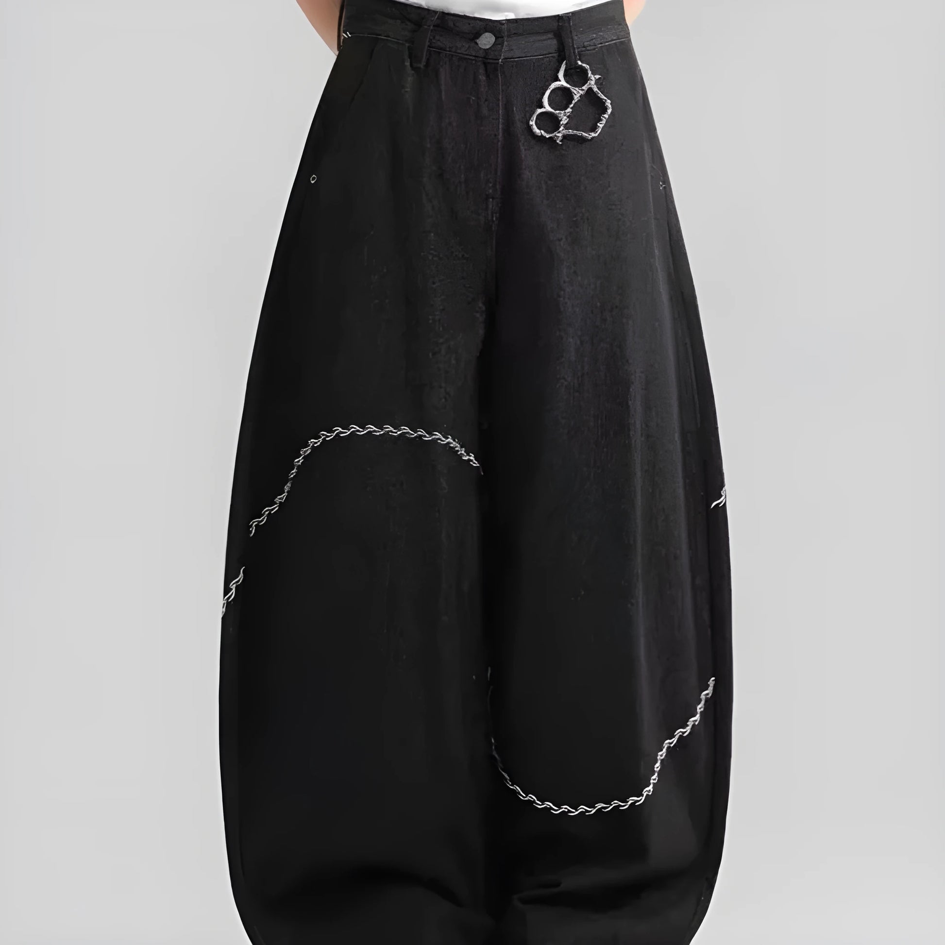 Men's black straight-leg denim trousers on a hanger, showing mid waist and zip fly detail.