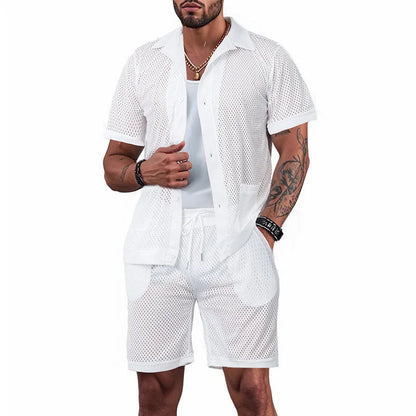 Light blue see-through beach shorts suit with matching cardigan on a summer background.
