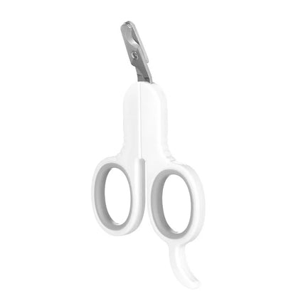Grey and pink pet nail clippers with curved tips and a rubber-coated ergonomic handle on a table.