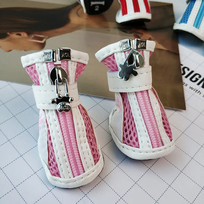 Blue dog shoes with front zipper closure and non-slip rubber soles for small pets.
