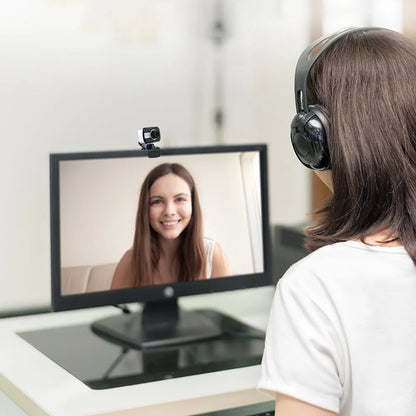 Blue mini USB webcam with a 1.45m cable showing its 360-degree rotating head on a laptop.