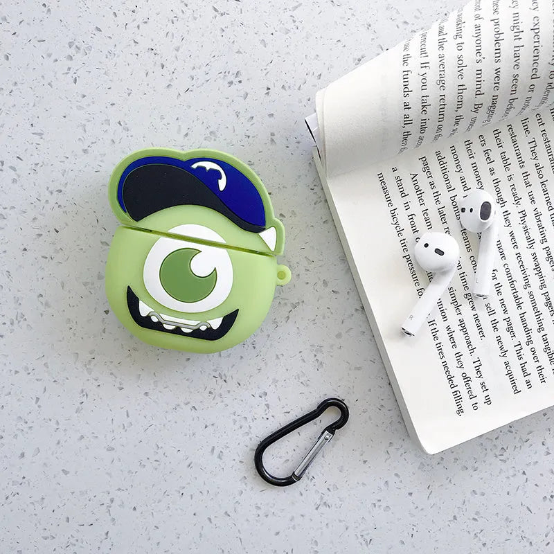 Green silicone AirPods case with raised cartoon animal design, showing charging port cutout.