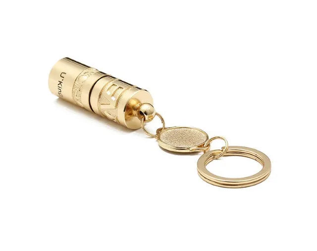 Gold zinc alloy keychain torch with LED light, shown attached to a keyring.
