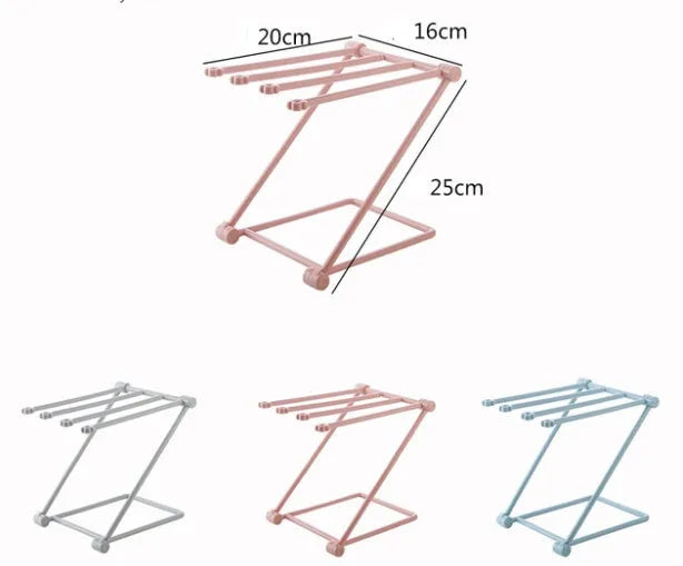 Foldable plastic dishcloth shelf organiser in light blue mounted on a wall.