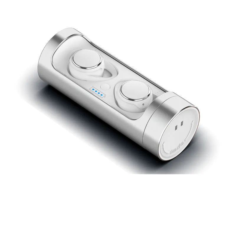 Dark Grey wireless Bluetooth headset with charging bay on a table.