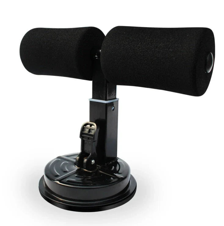 Compact sit-up strength trainer with steel springs and foam padding for home fitness