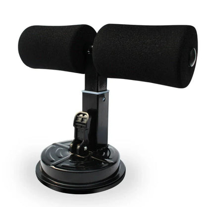Compact sit-up strength trainer with steel springs and foam padding for home fitness