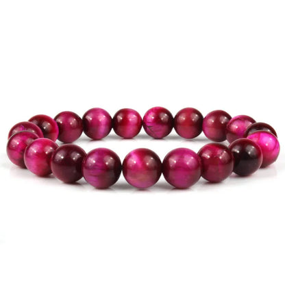 Natural tiger eye crystal bead bracelet showing round geometric beads on a wrist, available in multiple sizes and colour variations.