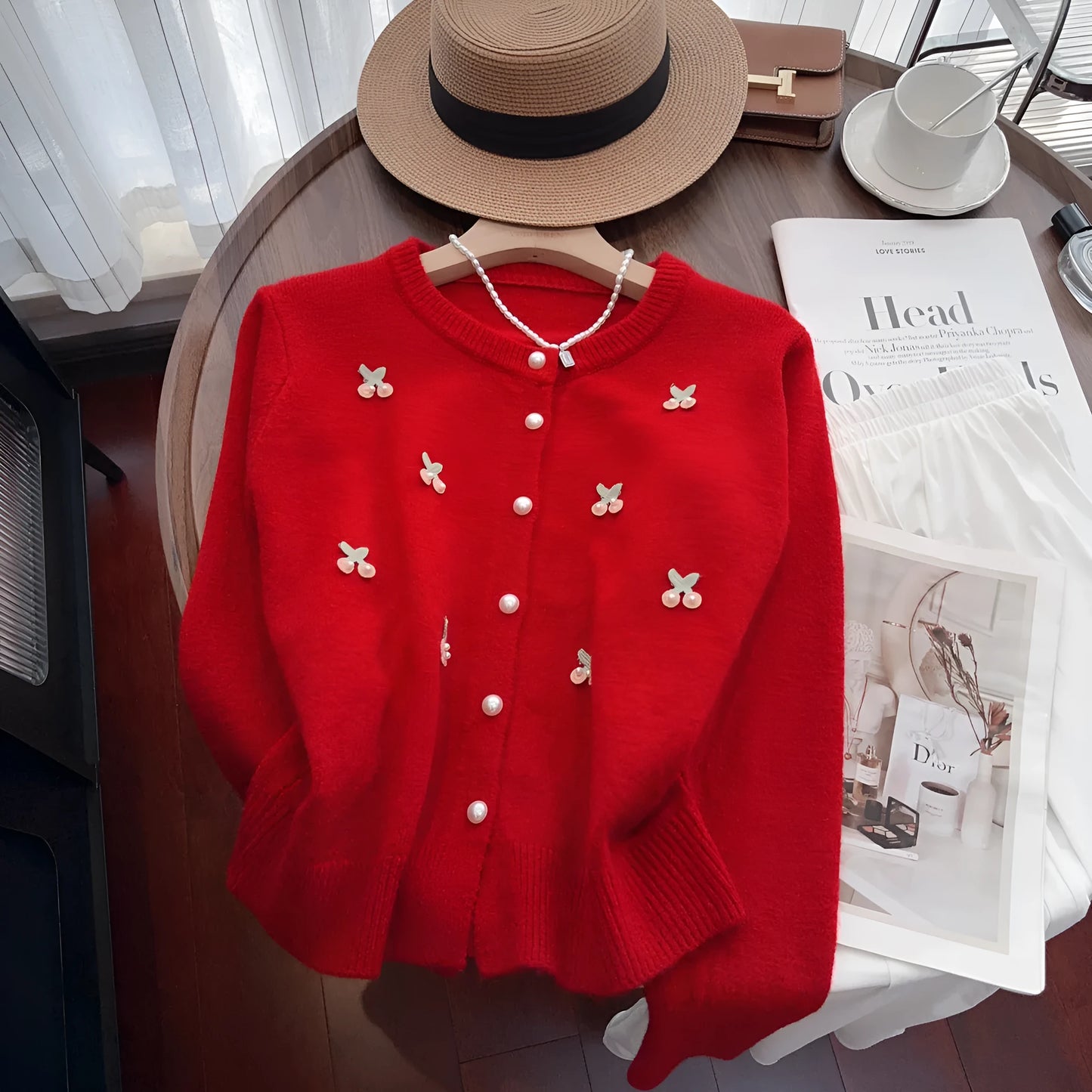 Pink women's slim fit cashmere cardigan coat with beaded details on a round neck.