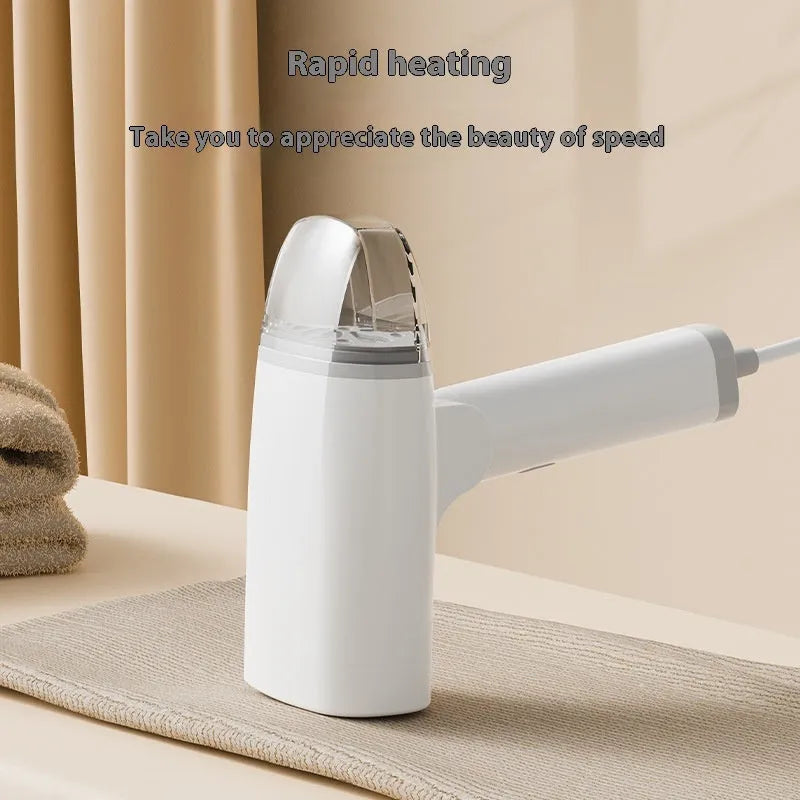 Blue handheld garment steamer with water tank, measuring 196mm long, on white background