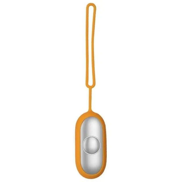 Hand-held micro-current sleep aid device in grey, green, or orange with round button and USB charging port