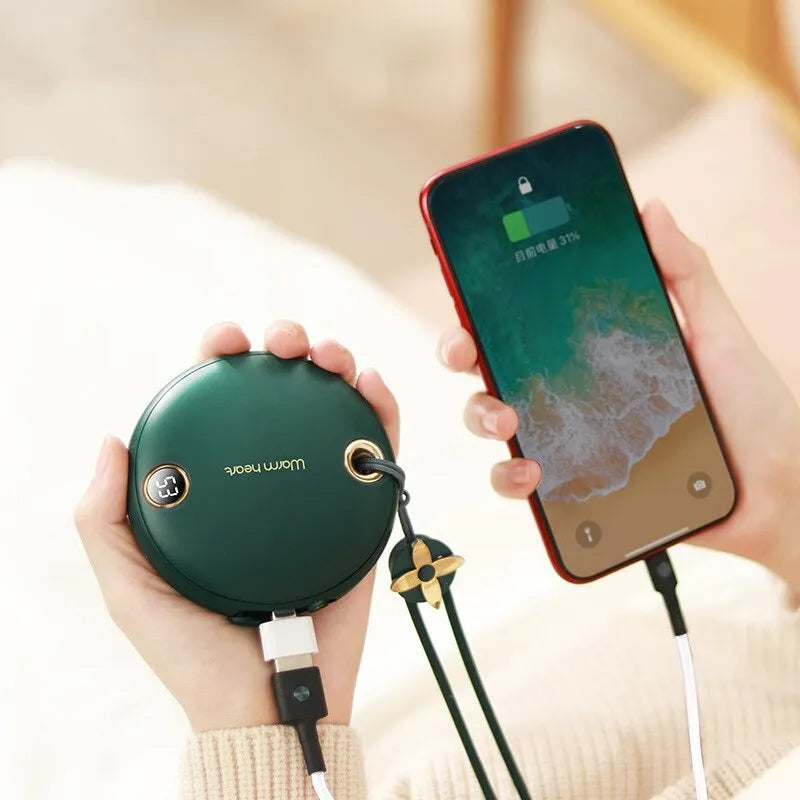 Green portable power bank with digital display showing battery percentage, sized next to a mobile phone for scale
