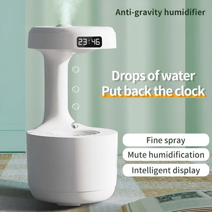 White columnar anti-gravity humidifier with water droplet backflow and LED clock display on a desk.