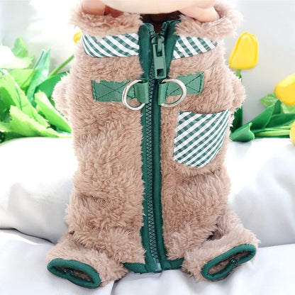 Green plush fleece dog jumpsuit on a small dog, showing the four-leg design and back zipper with D-ring.