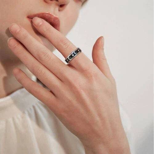 Rotatable stainless steel spinner ring with moon and star designs for anxiety relief and style