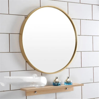 Round metal-framed wall mirror in black, white, or gold for bathroom.