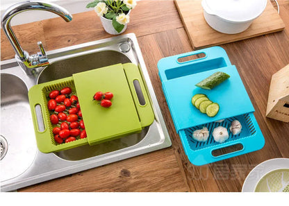 Blue multifunction kitchen chopping board with integrated sink drain basket and TPE handle.