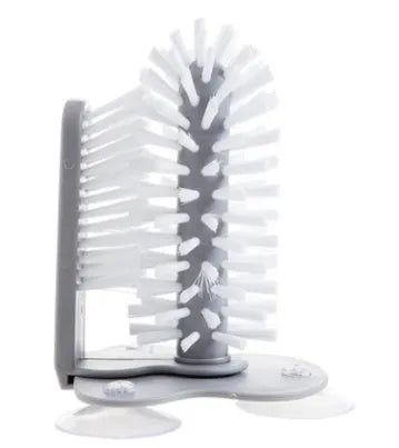 Grey suction cup brush with double-head design for cleaning cups and glasses