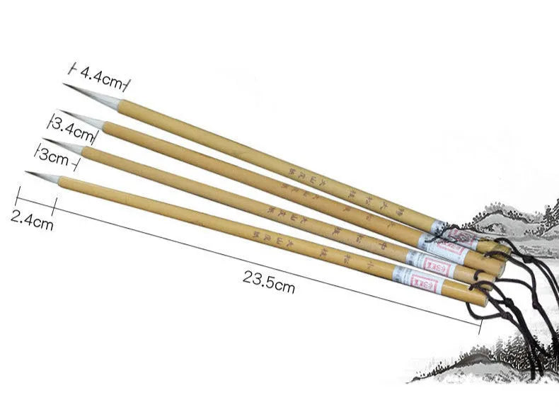 Four traditional writing brushes with gold bodies, wolf wool hair, and pine branch colour