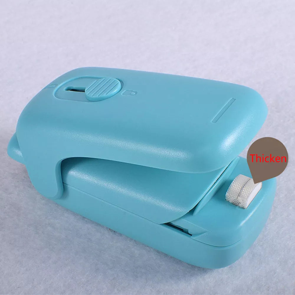 Mini sealing machine in blue with double electric heating wire for secure plastic bag seals