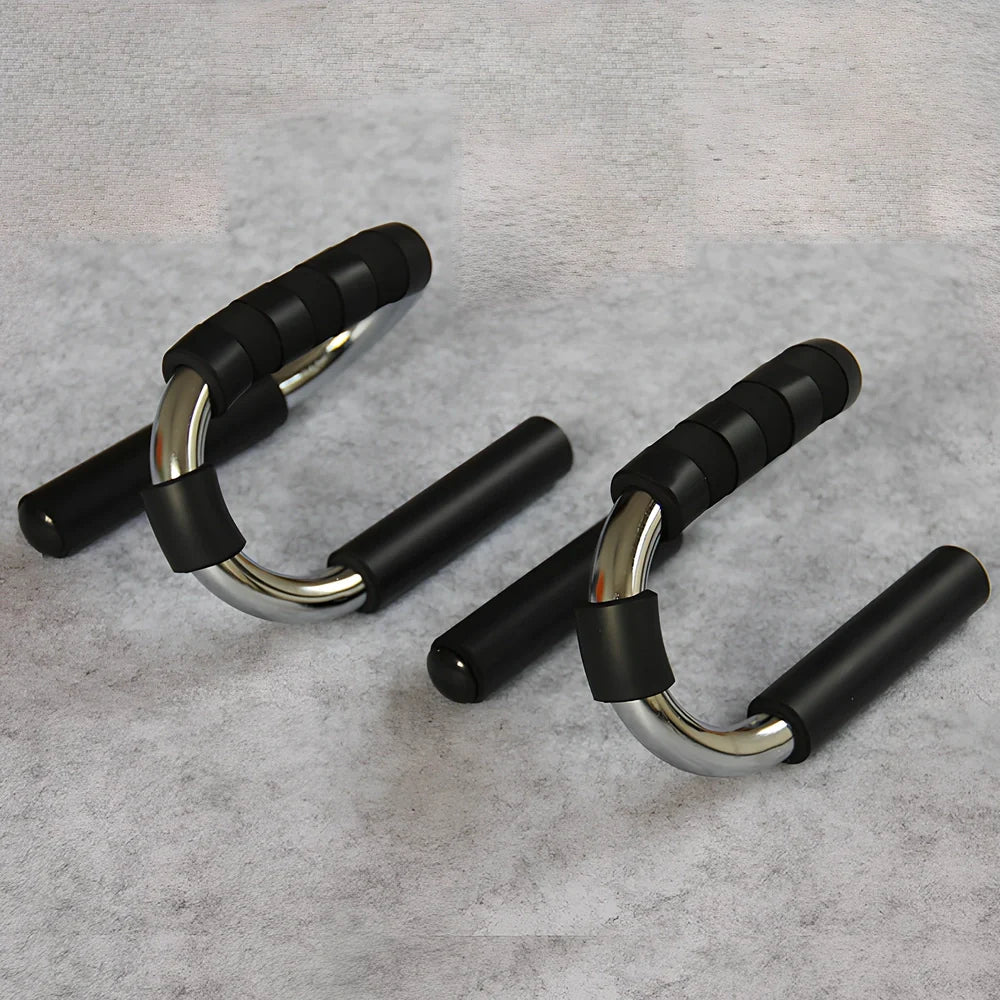 Green suction cup push-up bracket with electroplated steel frame and foam grips, supporting 300kg for chest training on floors