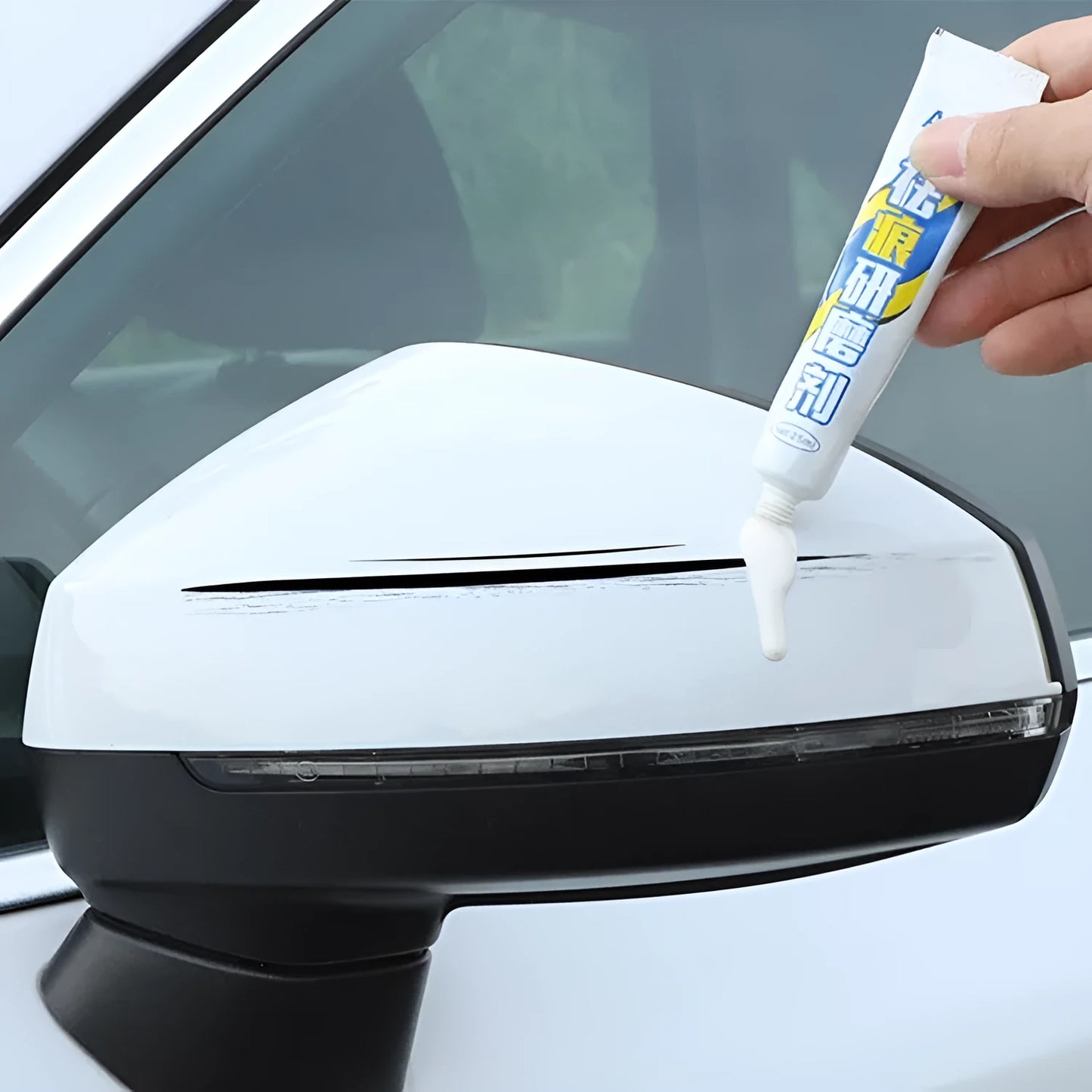 Automotive paint repair pen kit with touch-up fluid, wax, sponge, and sandpaper for car scratch repair