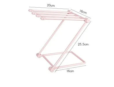 Foldable plastic dishcloth shelf organiser in light blue mounted on a wall.