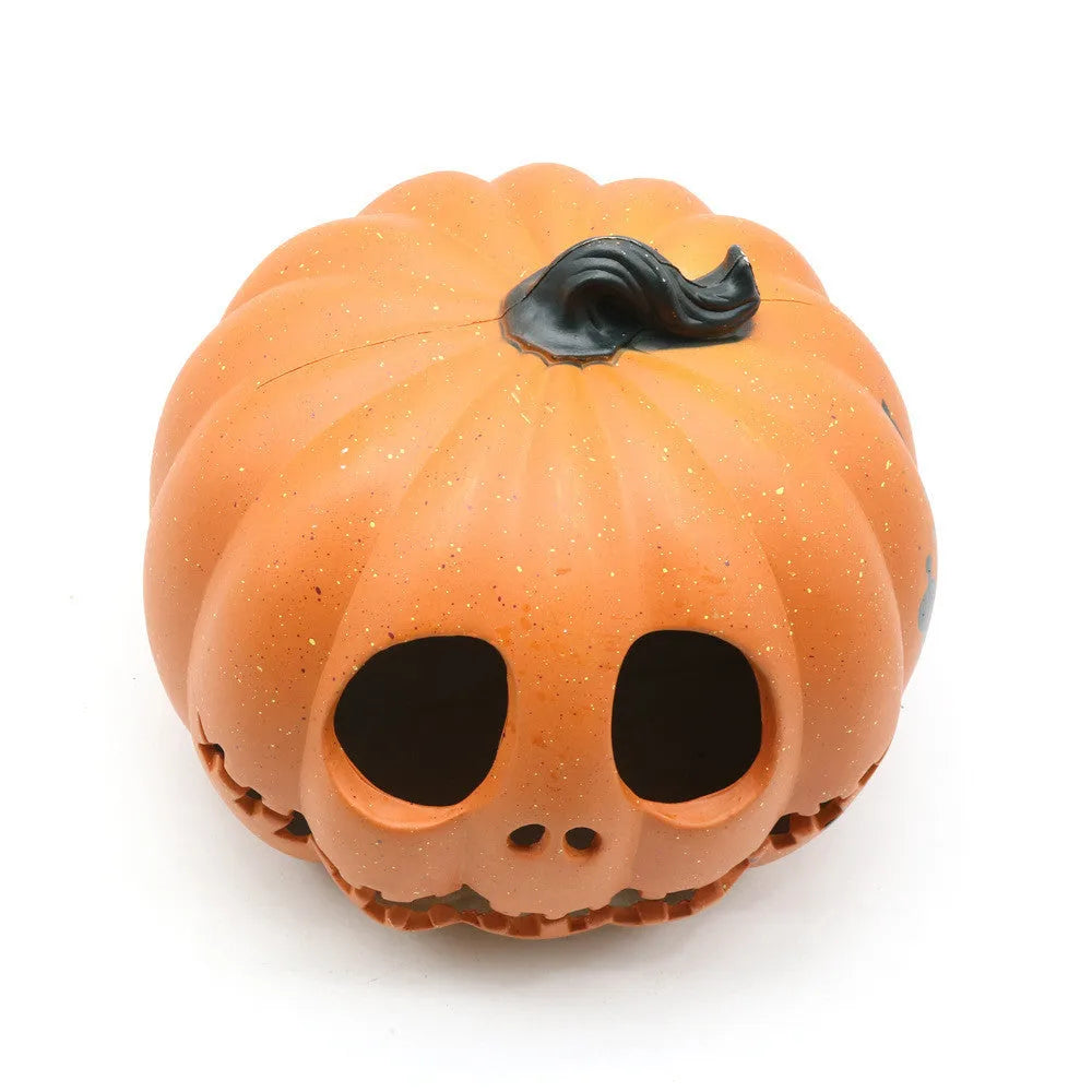 Yellow Halloween pumpkin lantern with hollow-out skull hooded design, resin prop measuring 23 x 19cm