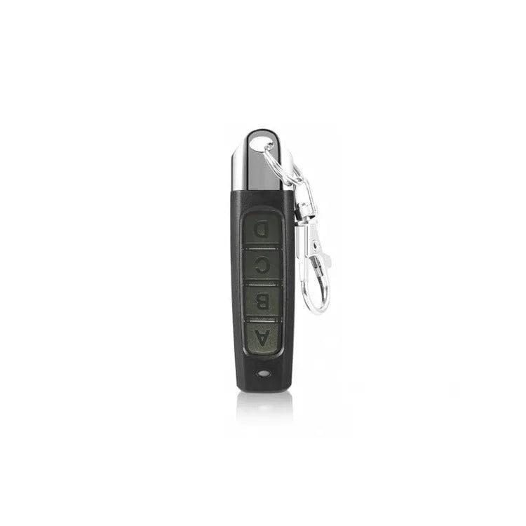 Rolling door remote control transmitter in four colour options showing compact 6.7cm design