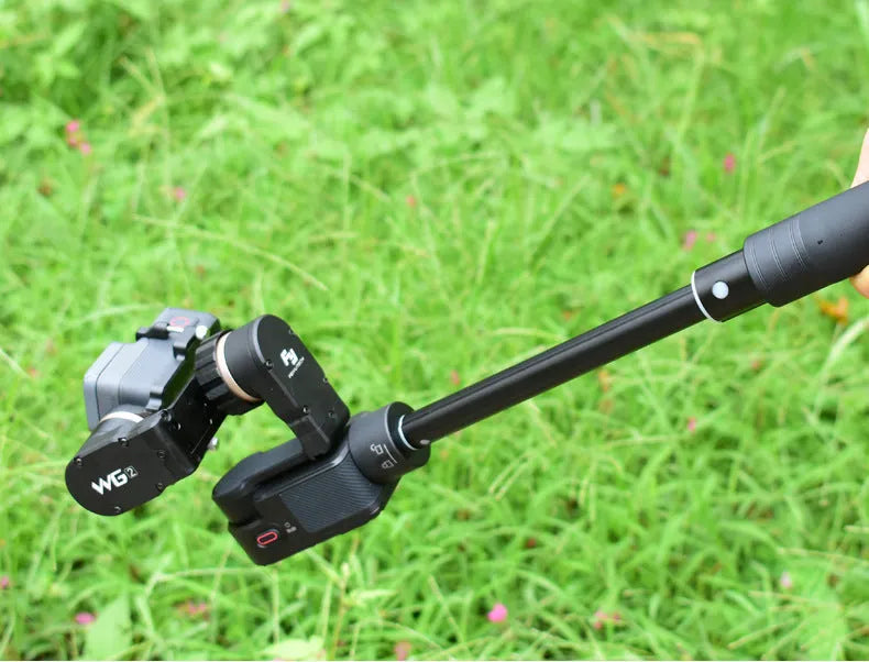 Black retractable selfie stick extended to 100cm with phone attached and Bluetooth remote