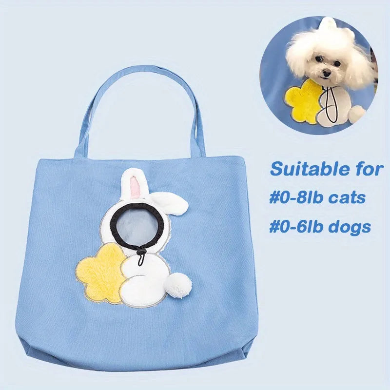 Little Bee Design blue canvas pet carrier bag with animal pattern, showing adjustable side opening for a pet's head.